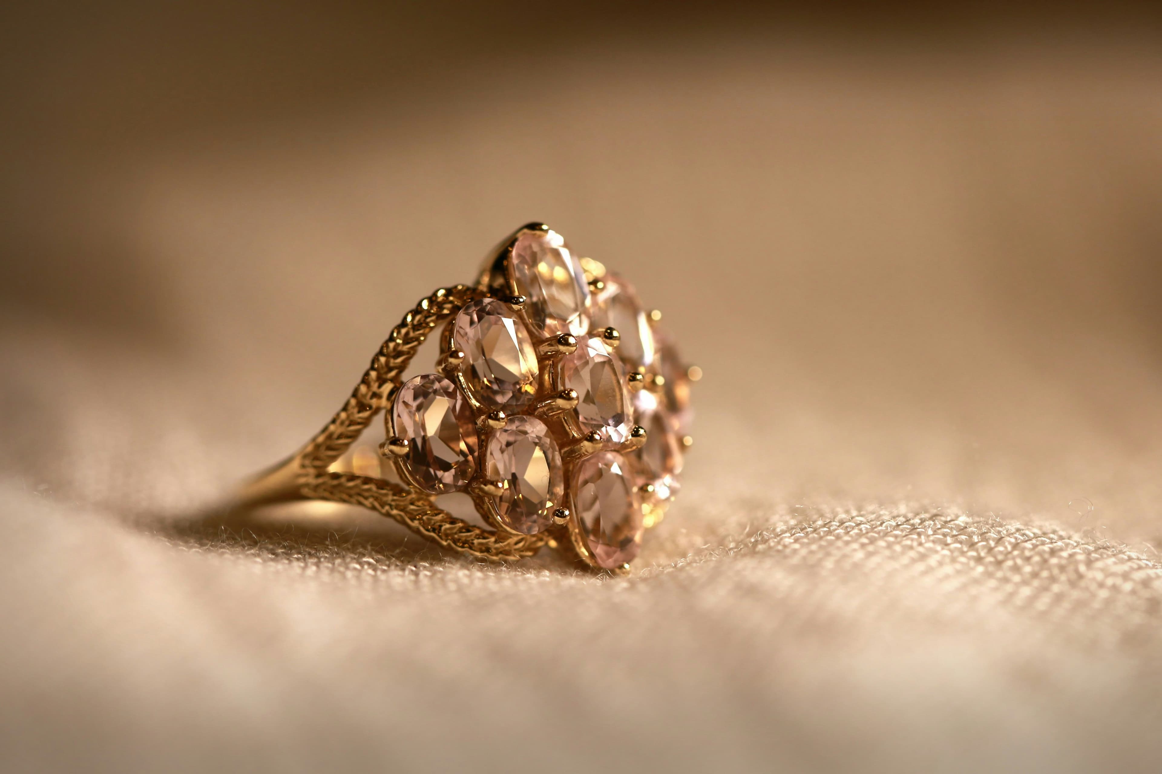 Oval solitaire ring with a warm rose gold setting